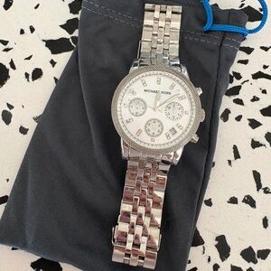 Michael Kors watch, needs new battery but it works! used